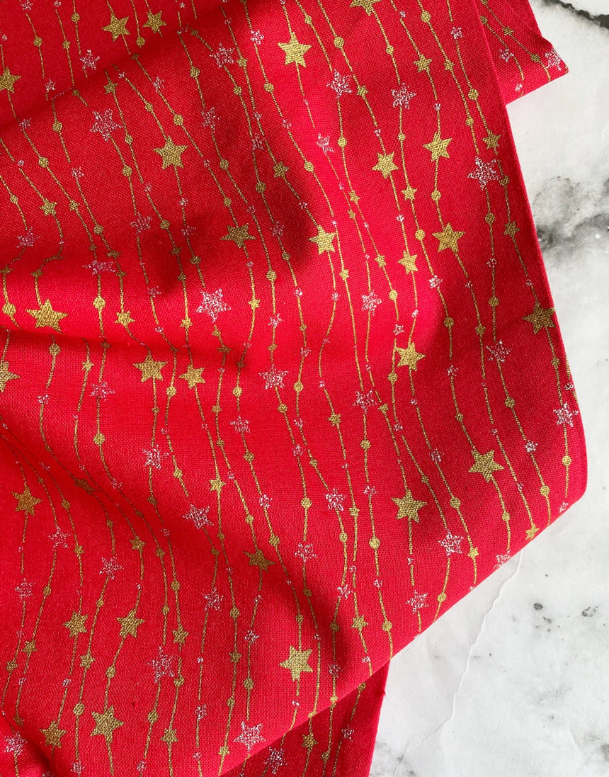 Red String of Glitter Stars Metallic Christmas Fabric